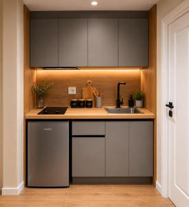 a kitchen with a sink and a counter top at Prima Garden Residence in Durrës