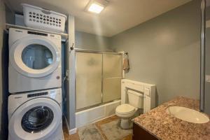 a bathroom with a washing machine and a toilet at Waterville Vacation Condo in Waterville Valley +44 photos
