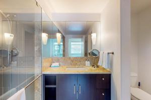 a bathroom with a sink and a mirror at Precious Pearl in Jackson