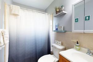 a bathroom with a shower and a toilet and a sink at Gloucester Getaway in Gloucester +30 photos