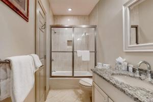 a bathroom with a toilet and a sink and a shower at Gloucester Harbor Hideaway in Gloucester +43 photos