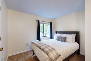 a bedroom with a bed and a window at Hodgman Getaway in Campton +58 photos
