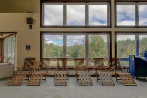 a room with chairs and a table and windows at Hodgman Getaway in Campton