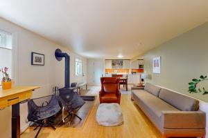 a living room with a couch and a dining room at Tensleep A10 in Teton Village