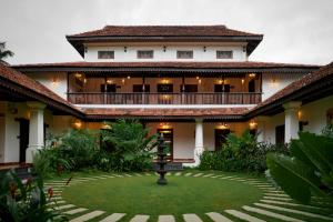an exterior view of a building with a courtyard at SVS Arena in Kizhake Chālakudi
