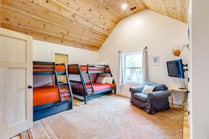 a room with two bunk beds and a chair at Ridgeview in Whitefield