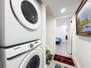 a laundry room with a washer and dryer at Smart & Cute 1BR Basement Apartment-Milton in Milton