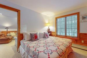 a bedroom with a bed and a large window at Red Fox Retreat in Denmark