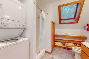 a bathroom with a toilet and a sink and a window at Red Fox Retreat in Denmark +45 photos