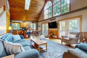 a living room with a couch and a table at Bethel Peak Escape in Bethel