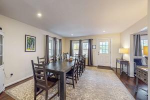 a dining room with a table and chairs at Kendall Brooke in North Conway +40 photos