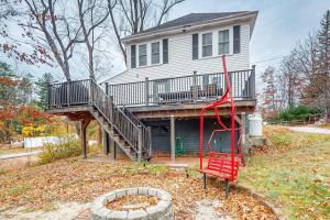 a house with a red slide in front of a house at Kendall Brooke in North Conway