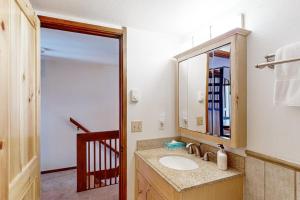 a bathroom with a sink and a mirror at Wister C in Teton Village +66 photos