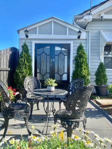 a patio with a table and chairs in front of a house at Studio 59 Newport sleeps1 in Newport