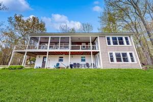a large house with a large porch on a lawn at The Betty in Jackson