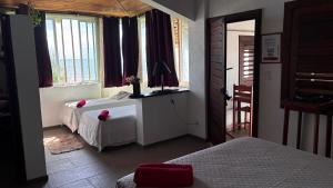 a bedroom with two beds and a window at WegoKite Stars in Taíba +145 photos