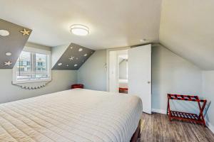a bedroom with a large bed in a attic at Wishing Wells in Wells