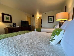 a hotel room with two beds and a television at Oceanview Studio at Kauai Beach Resort #2444 in Lihue +34 photos