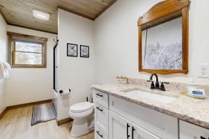 a bathroom with a sink and a toilet and a window at Brightwind Lodge in Bethel +61 photos