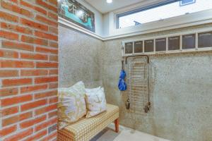 a room with a brick wall with a couch and a shelf at Cumberland Charm in Portland +34 photos