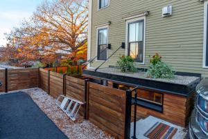 a wooden fence in front of a house at Cumberland Charm in Portland