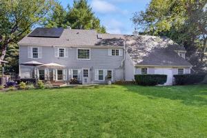 a house with solar panels on the roof at 10-Minute Walk to the Beach in Cumberland Foreside