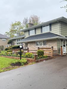 a house with a fence in front of it at Private Guest Suit-Self Checkin-Near Downtown in Charlottetown