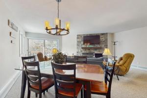 a dining room and living room with a table and chairs at Brookhaven D4 in Ludlow