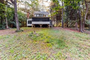 a tiny house in the middle of a forest at Garden Island's Cedar in Charlotte