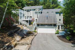 a large house with a garage and a driveway at Tideview Estate in Cumberland Foreside
