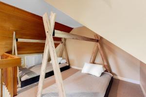 two bunk beds in a room with stairs at Chipper View in Jackson
