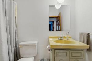 a bathroom with a sink and a toilet and a mirror at The Prospect House in Bethlehem +54 photos