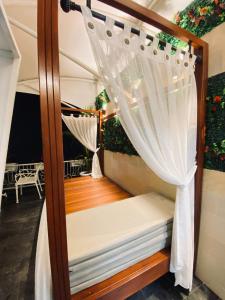 a room with a bed and a curtain at The Heaven Royal Glamp in Bedakah