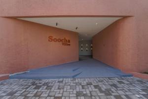 a building with a sign that reads scotia wine at Soocha Villas in Yogyakarta