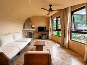 a living room with a couch and a fireplace at Camly the Boutique in Da Lat +50 photos