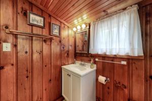 a bathroom with a toilet and a sink and a mirror at Otis Cottages in York +56 photos
