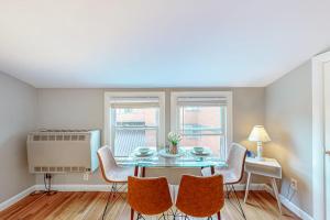 a dining room with a table and chairs at Cumberland Casa - B in Portland +24 photos