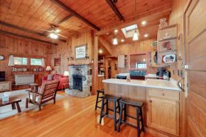 a kitchen and living room with a fireplace at Brandy Shores in Naples