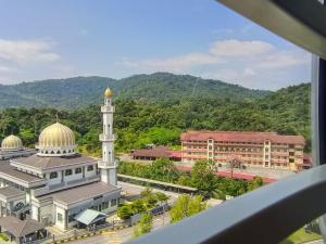 a view of a mosque with a tower and a building at D'Nas Homestay in Rawang