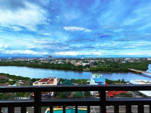 a view of a river from a balcony at California style Resident in Iloilo City