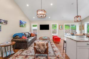 a living room with a couch and a table at Lake Dreams in Lakeside