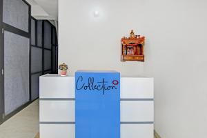 a blue box in a room with a clock on a wall at Hotel O Ethereal Inn in New Delhi