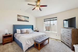 a bedroom with a bed and a ceiling fan at Bridger View Retreat in Belgrade