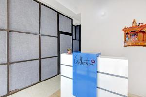 a blue refrigerator in a room with a wall at Hotel O Ethereal Inn in New Delhi