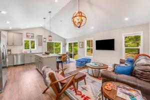 a living room with a couch and a table at Lake Time in Lakeside
