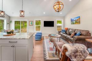a kitchen and living room with a couch and a table at Lake Time in Lakeside