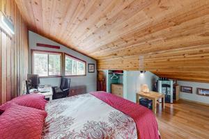 a bedroom with a bed and a wooden ceiling at Lost Trail 101 in Whitefish +100 photos