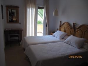 Postel nebo postele na pokoji v ubytování Hotel Antonio