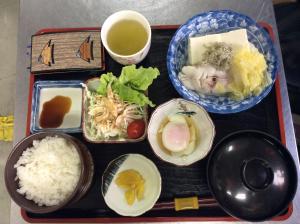 a tray of food with rice and bowls of food at Asahi City Inn Hotel in Takaoka