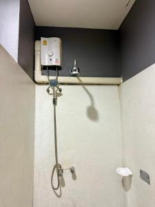 a shower in a bathroom with a shower head at KT Garden Villa in Ko Samui +8 photos
